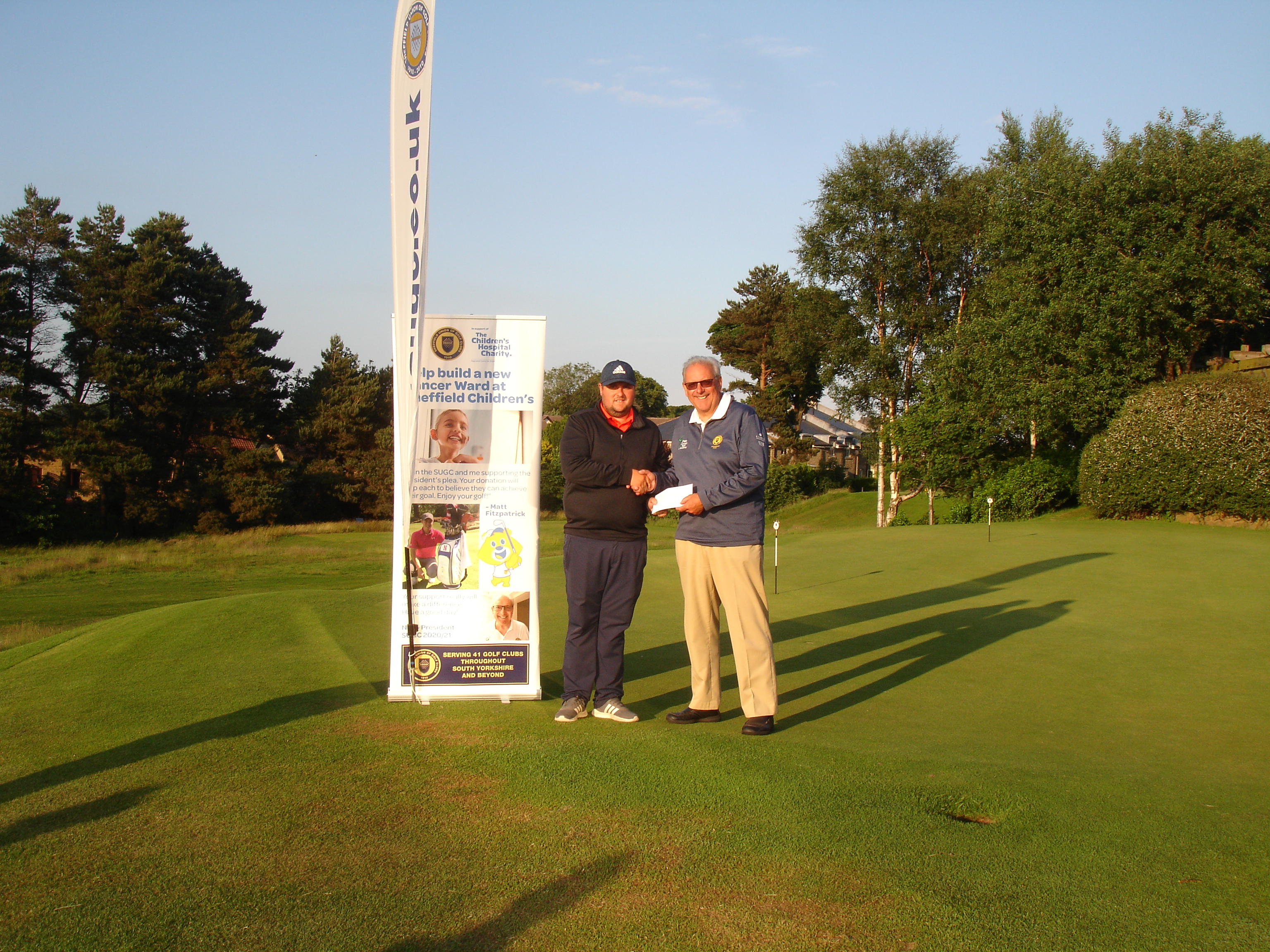 Oliver receiving his Runners Up prize from Neil Leatherland, SUGC President