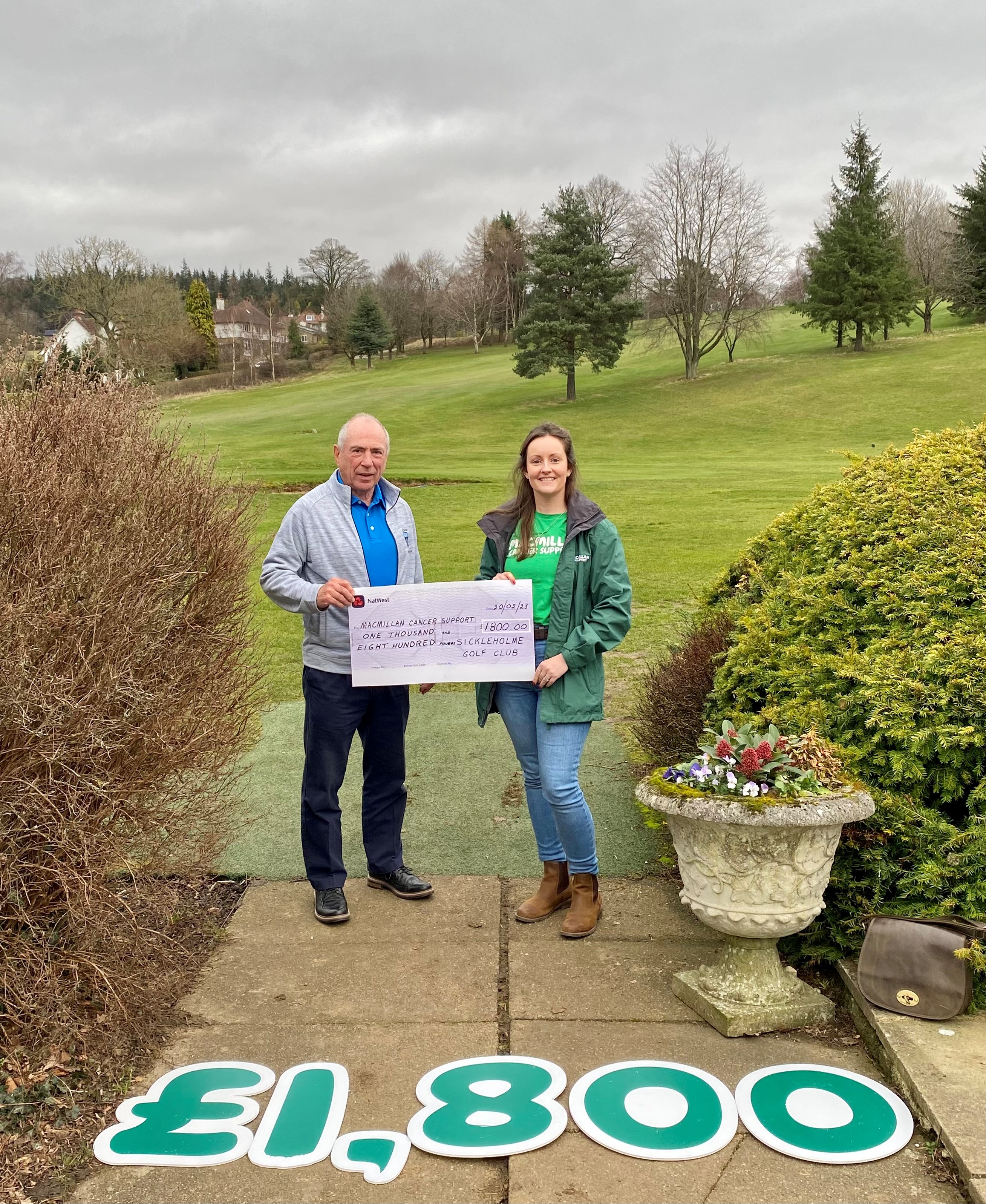 Richard Lomer presenting a cheque for the money raised towards his chosen charity