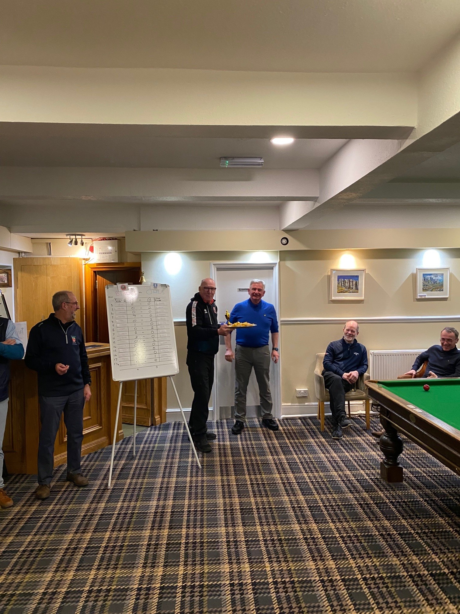 George Clarke receiving the losing teams greasy chip buttie from the Blades Captain